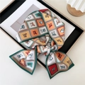 Elegant green silk neck scarf with equestrian horse prints tied in a bow - Equestrian Helmet Grid Green Red