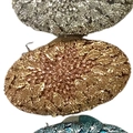 Detail view of oval evening bags in silver, gold, and blue with leaf textured metal finish - Champagne