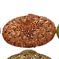 Macro detail of amber rhinestone evening bag with intricate leaf-shaped crystal pattern - Orange