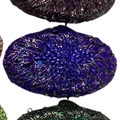 Detailed macro view of an oval evening clutch bag with sparkling purple and blue crystals - Sapphire Blue