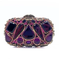 Detailed close-up of luxury purple crystal evening bag with gold metal frame - Purple