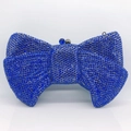 Macro detail of sparkling blue rhinestones and crystal clasp on a bow evening clutch - Dark Blue