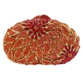 Macro detail of luxury leaf-patterned clutch with red and orange crystals on gold metal - Orange Red