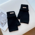 Detail of black knitted convertible mittens with leather logo patch and ribbed cuffs - One Size / Black