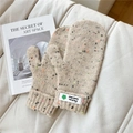 Detail of beige knitted mittens with colorful polka dots and ribbed cuffs for winter warmth - Starry Green Flower Cream White