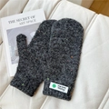 Detail of grey thick knit mittens with colorful flecks and fashion brand label - Starry Green Flower Black