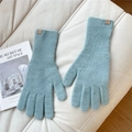 Detail of light blue knit wool gloves with a brown leather logo patch on ribbed cuffs - One Size / Blue
