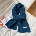 Detailed close-up of dark blue 100% wool knit scarf with premium ribbed texture and label - 23*170cm / Navy Blue