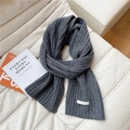 Detailed texture of dark grey 100% wool knitted scarf with ribbed pattern and label - 23*170cm / Gray