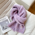Close-up of thick chunky knit scarf in purple and pink with gold brand logo plate - Mixed Purple