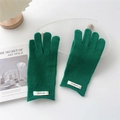 Detailed view of dark green wool knit gloves with white 100% wool material label - Dark Green