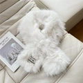 Detail of white faux fur cross scarf featuring a minimalist black fashion label and soft texture - Cream