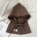Detail view of brown knit balaclava with warm faux fur lining and decorative buttons - One Size / Brown