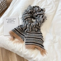 Detailed shot of striped knitted wool scarf with fringe and retro Jennie Wool 1985 label - Grey Color Fringe Stripes