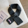Detail of dark grey knit scarf showing thick wool texture and lilac brand label - Dark Gray
