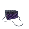 Macro detail of purple crystal encrusted clutch bag featuring silver snake chain strap - Purple