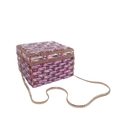 Macro detail of pink crystal rectangle clutch with gold metal frame and snake chain - Pink