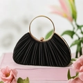 Detailed close-up of pleated satin evening bag with a circular gold metal handle - Black