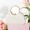 Macro detail of pleated white satin evening bag with a polished gold ring handle - White