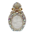 Macro detail of perfume bottle clutch bag featuring sparkling rhinestones and golden bow - Gold AB