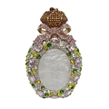 Macro shot of crown clasp and pink bow detail on champagne gold rhinestone evening bag - Gold Multicolor