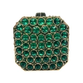 Vista dettagliata di una borsa a mano ottagonale in strass verde smeraldo e oro - Verde