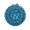 Detailed close-up of dark blue crystal rhinestones on a circular gold metal evening clutch - Lake Blue