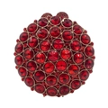 Macro detail of luxury round evening clutch featuring red crystals and gold metal frame - Red