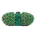 Primer plano detallado de strass verde esmeralda en un bolso de fiesta dorado de lujo - Verde