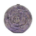 Detail of round clutch bag featuring purple rhinestone rose pattern and metal clasp - Violet