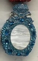 Elegant shell stone evening bag with blue crystals and bow detail for party attire - Lake Blue