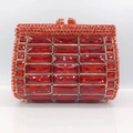 Macro shot of luxury red crystal evening clutch bag with gold-tone metal frame and clasp - Red with Gold Hardware