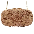 Detailed macro of rose gold evening clutch with hollow floral crystal patterns - Champagne