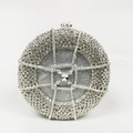 Close-up of circular silver evening bag featuring woven mesh pattern and sparkly rhinestones - Silver