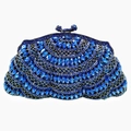 Detailed close-up of dark blue crystal rhinestones on a shell-shaped evening clutch bag - Royal Blue