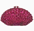 Close-up of sparkling rose pink rhinestone-encrusted fan-shaped evening clutch with metal clasp - Rose Red