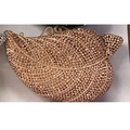 Macro shot of leaf-shaped evening clutch with sparkling rhinestones and metal closure - Champagne