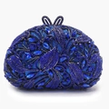 Royal blue crystal evening clutch bag featuring intricate peacock feather pattern design - Sapphire Blue
