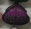Macro detail of luxury rhinestone evening clutch with purple and black striped crystal patterns - Purple
