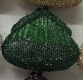 Detail of green rhinestone evening bag showing vintage metal clasp and shiny crystal texture - Green