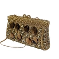 Detail of golden rhinestone clutch featuring large amber crystals and mesh metal design - Crystal Yellow