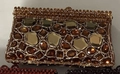 Macro detail of the amber rhinestone evening clutch with vintage metal frame and crystals - Coffee