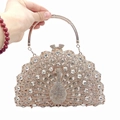 Macro shot of peacock evening clutch bag featuring intricate rhinestones and rose gold handle - Rose Gold