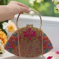 Close-up of fan-shaped clutch with multicolored rhinestones and floral crystal pattern - Gold Multicolor