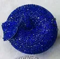 Macro detail of sparkling royal blue rhinestones on a luxury evening apple clutch bag - Sapphire Blue