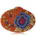 Close-up of floral rhinestone evening clutch featuring blue roses and gold leaves - Orange