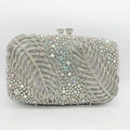 Macro detail of luxury silver rhinestone evening clutch with feather leaf pattern texture - Silver AB