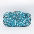 Macro shot of an evening clutch bag featuring light blue and silver rhinestone swirls - Sky Blue Vortex Wave Texture (4)
