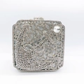 Detailed view of silver evening clutch bag with sparkling crystals and metal frame - Silver
