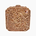 Close-up of champagne gold rhinestones and intricate patterns on the square clutch bag - Champagne